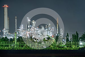 Petrochemical oil refinery and sea in industrial engineering concept in Bangna district, Bangkok, Thailand. Oil and gas tanks