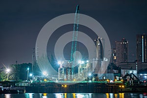 Petrochemical oil refinery and sea in industrial engineering concept in Bangna district, Bangkok, Thailand. Oil and gas tanks