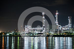 Petrochemical oil refinery and sea in industrial engineering concept in Bangna district, Bangkok, Thailand. Oil and gas tanks