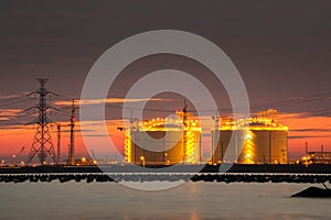 Petrochemical plant in night time with reflection over the river