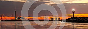 Petrochemical plant in night time with reflection over the river photo