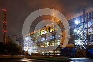 Petrochemical plant in night. Urea Granulation Tower fertilizer granulator prilling high-tower complex. Long exposure