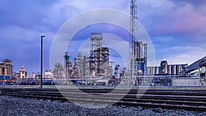 Petrochemical production plant against a cloudy blue sky at twilight, Port of Antwerp, belgium