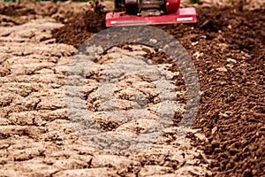 Petrol cultivator tills compacted soil