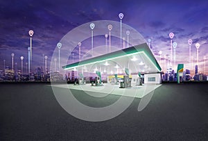 Petrol gas station station at night with spot location icon connect between city building