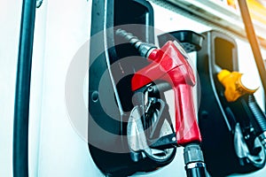 Petrol pump filling fuel nozzle in gas station. Fuel dispenser machine. Refuel fill up with petrol gasoline. Petrol industry and