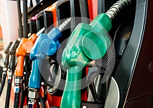 Petrol pump filling fuel nozzle in gas station. Fuel dispenser machine. Refuel fill up with petrol gasoline. Petrol industry and