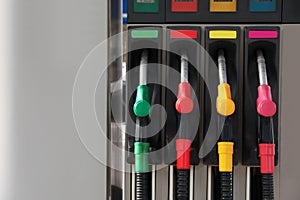 Petrol pump filling nozzles at gas station