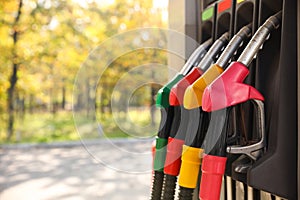 Petrol pump filling nozzles at gas station