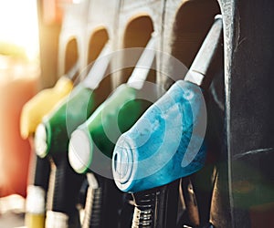 Petrol pump filling nozzles at Gas station