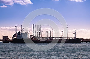 Petrol ship supplying petrol to a refinery