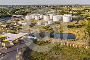 Petrol station and petrol tanks in the background. Oil storage photo