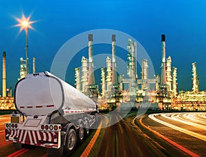 Petroleum container truck and beautiful lighting of oil refinery