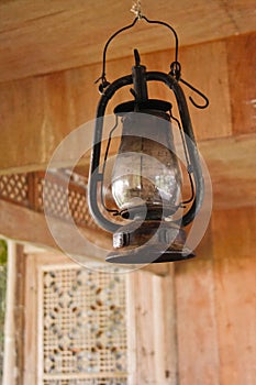 Petroleum lamp in old wooden house