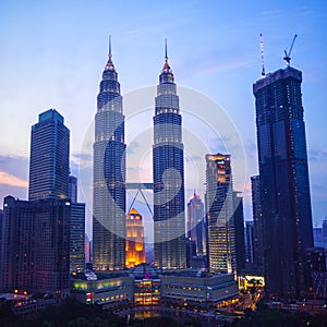 Petronas Twin Towers fondly known as KLCC and the surrounding buildings at evening