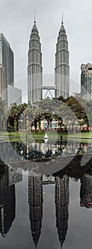 Petronas twin towers that reflected on the pool in Kuala Lumpur, Malaysia