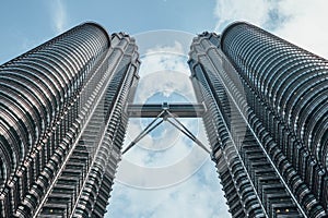 Petronas twin towers viewed from below in Kuala Lumpur, Malaysia