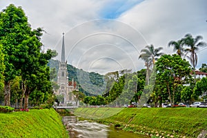 Petropolis Cathedral Facade with Flowing River and Abstract Time-lapse Sky