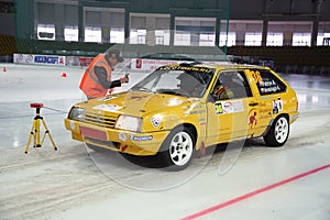 Petrov and Vereshagin in racing car on ice in sports complex