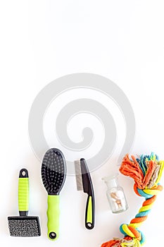 Pets cure with brush for treatment set on white background top view mock up