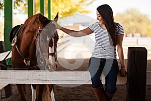 Petting my horse at a ranch