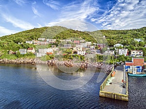 Petty Harbour with two piers during summer sunset, Newfoundland, Canada