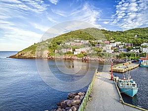 Petty Harbour with two piers during summer sunset, Newfoundland, Canada