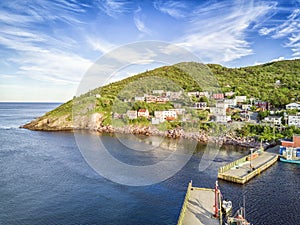 Petty Harbour with two piers during summer sunset, Newfoundland, Canada