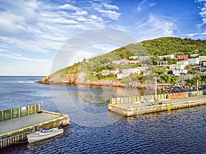 Petty Harbour with two piers during summer sunset, Newfoundland, Canada