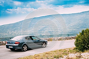 Peugeot 407 car on background of French mountain nature landscape