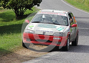 A Peugeot 106  rally car at the Alba Rally on 28 July 2019