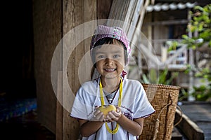 Pga Ka nyau Pakhayo Tribe Children Show the persimmon in her house. Ban Pa Bong Piang Northern region in Mae Chaem District