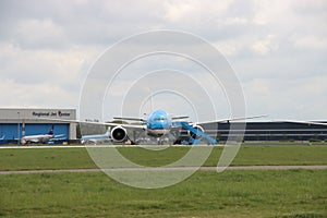 PH-BQL KLM Asia Boeing 777 idle on landing strip Aalsmeerbaan of Amsterdam Schiphol Airport in the Netherlands, parked due to canc