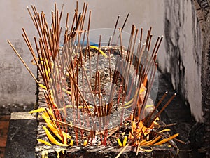 Pha That Luang Stupa, Vientiane - incense sticks burning