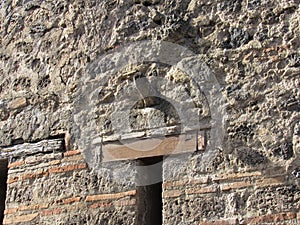 Phallus shaped object above brothel door in Pompeii