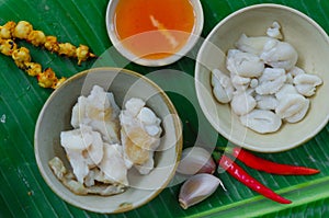 Phan Thiet street foods made from squid: grilled squid cake, steamed squid`s egg and fried squid`s mouth - Rang muc nuong