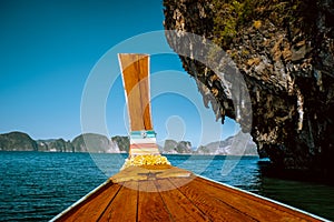 Phangnga Bay ocean with green Island on a beautiful day with blue sky, longtail boat sail on ocean in Thailand