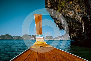 Phangnga Bay ocean with green Island on a beautiful day with blue sky, longtail boat sail on ocean in Thailand