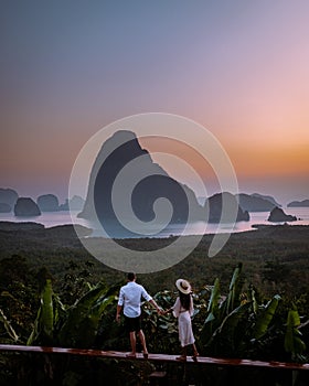 Phangnga Bay Thailand , Samet Nang She viewpoint over the bay, couple honeymoon vacation Thailand watching sunsrise