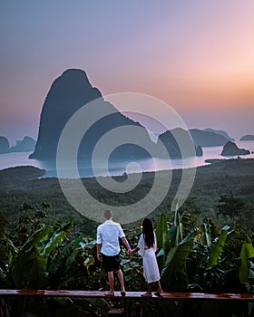 Phangnga Bay Thailand , Samet Nang She viewpoint over the bay, couple honeymoon vacation Thailand watching sunsrise