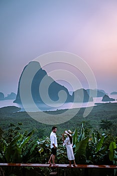 Phangnga Bay Thailand , Samet Nang She viewpoint over the bay, couple honeymoon vacation Thailand watching sunsrise