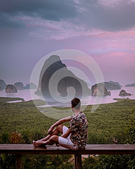 Phangnga Bay Thailand , Samet Nang She viewpoint over the bay, men vacation Thailand watching sunsrise