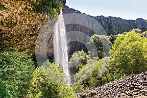 Phantom Waterfall dropping off over vertical basalt walls, North Table Mountain Ecological Reserve, Oroville, California