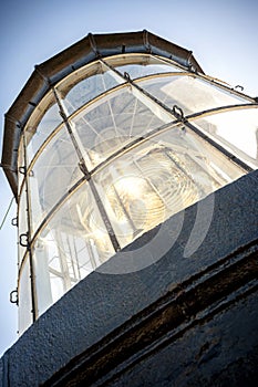 Phare de Chassiron.Top of the lighthouse with signal lens. Island D`Oleron in the French Charente with striped lighthouse. France.