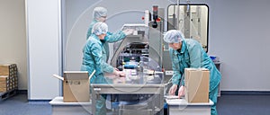 Pharmaceutical factory workers in sterile environment