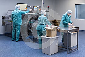 Pharmaceutical factory workers in sterile environment