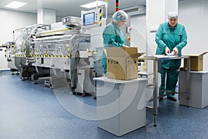 Pharmaceutical factory workers in sterile environment