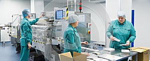 Pharmaceutical factory workers in sterile environment