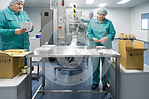 Pharmaceutical factory workers in sterile environment