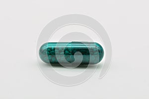 Transparent green pills photo